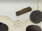 a close up of a piece of metal with a hole in it