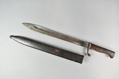 a knife and a knife holder on a white surface