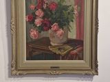a painting on the wall of a room with a vase of flowers on it