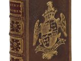 un vieux livre avec un blason sur la couverture