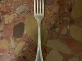 a fork and a spoon sitting on a table