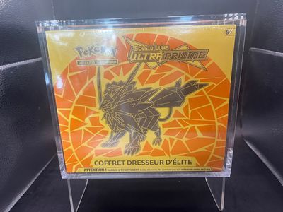 a close up of a box of pokemon cards on a table
