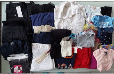 a lot of clothes that are sitting on a table