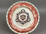 an image of a plate with a flower design on it