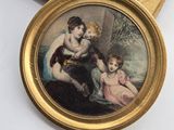 a picture of a picture of a woman and two children