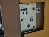 a machine that is sitting inside of a wooden cabinet