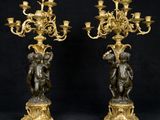 pair of antique bronze candelabs with cher chers