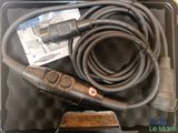 a black case with a hose and a cord in it