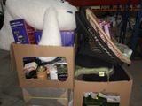 two boxes with items in them sitting on the floor