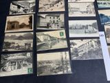 several old black and white photographs of buildings and buildings on a table