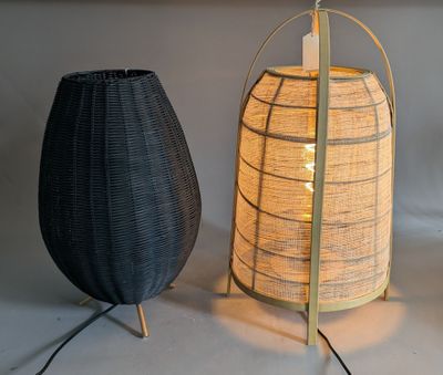 two lamps sitting next to each other on a table