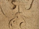 a stone carving of an angel with a crown on it