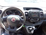 the interior of a car with a steering wheel and dashboard controls