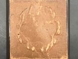 an image of a picture of a horse in a frame on a table