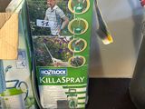 boxes of gardening supplies sit on a table next to scissors and a watering hose