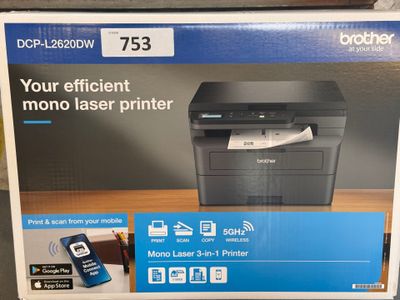 le carton de l'imprimante Brother est posé sur la table