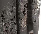 a close up of a black dress with lace on it