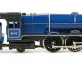 a toy train that is sitting on a white surface