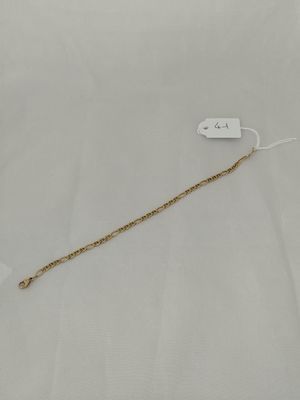 a close up of a gold chain with a tag attached to it
