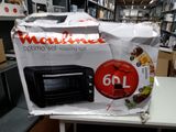 a microwave sitting on top of a table in a store