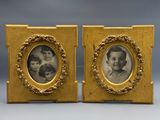 pair of antique photo frames of a woman and two children