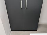 two doors that are open in a small room