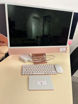 a computer on a desk with a keyboard and mouse