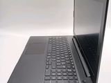 a laptop computer sitting on top of a white table