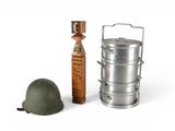 a toy soldier ' s helmet and a metal container