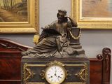 a clock that is sitting on a table in a room