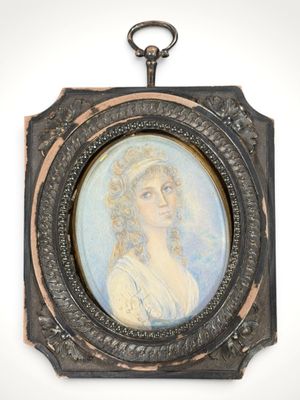 an old picture of a woman in a white dress is hanging on a wall