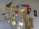 a table with a lot of pins and badges on it
