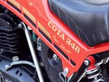 a red motorcycle parked on the side of the street