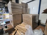 a large pile of boxes sitting on a pallet in a warehouse