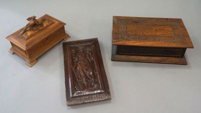 three wooden boxes sitting on top of a table next to each other
