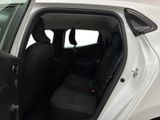 a white car with the door open and the seats down