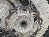 a close up of a motorcycle wheel with a tire on it