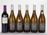 six bottles of wine are lined up in a row
