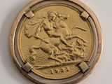 an image of a gold coin with a picture of a woman on a horse