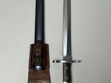 an image of a knife and sheath on a white surface