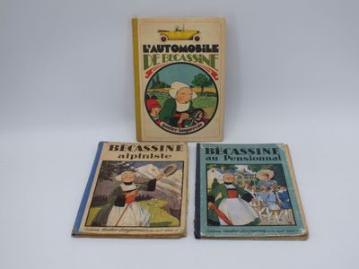 trois livres pour enfants sont posés sur une surface blanche