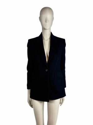an image of a mannequin wearing a black blazer and shorts