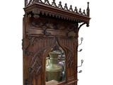 a wooden cabinet with a mirror on top of it
