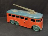 a toy bus that is sitting on a black surface