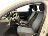 the interior of a small car with two seats and a steering wheel