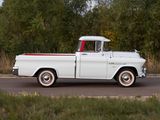 a white truck that is driving down the road