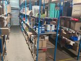 many shelves with boxes and boxes on them in a warehouse