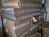 many boxes stacked on top of each other in a room