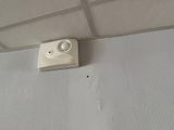 a camera mounted to the ceiling of a bathroom