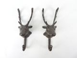pair of antique cast iron deer head hooks
